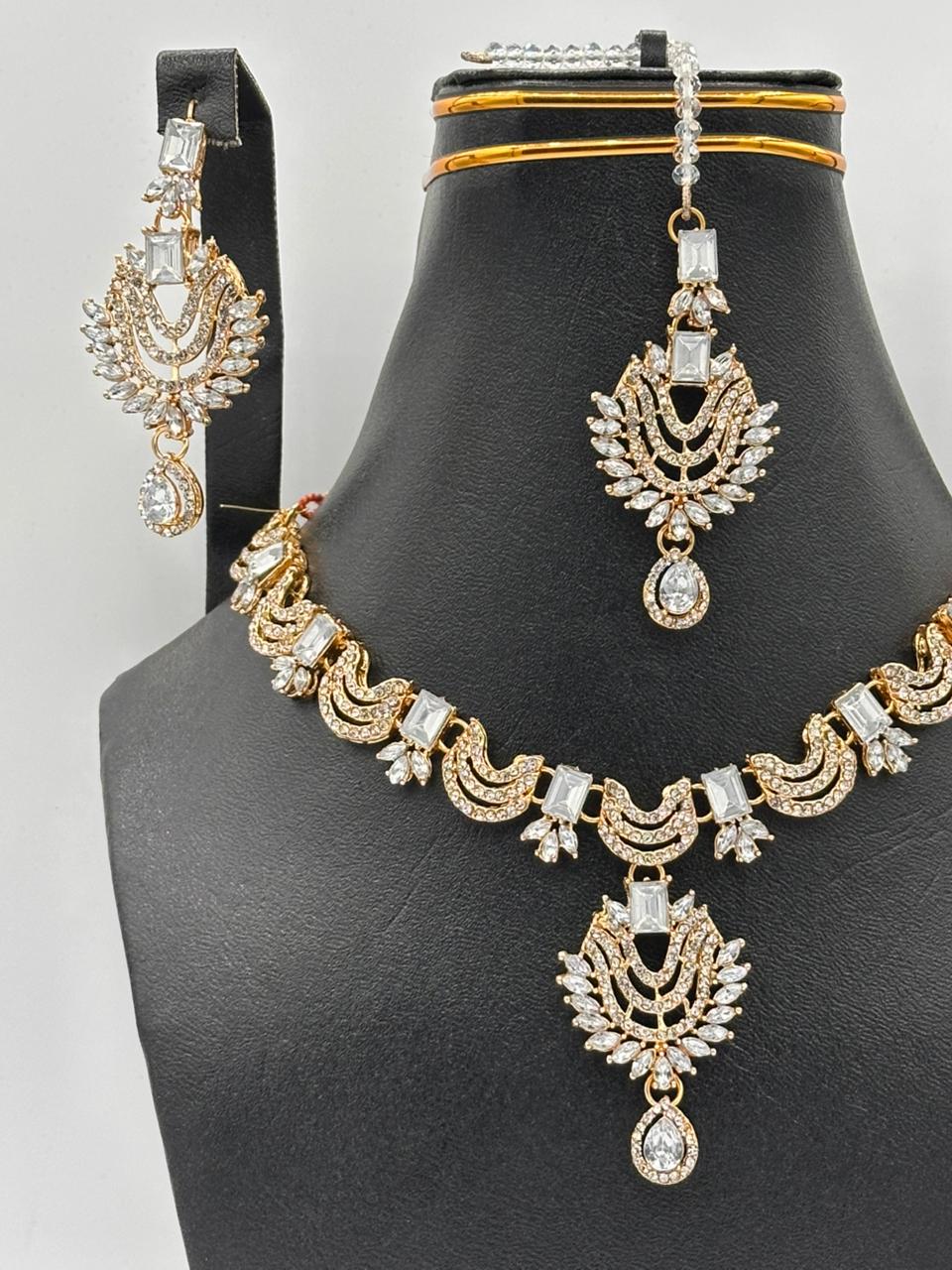 Timeless Kundan-Style Gold Choker Set with Floral Maang Tikka