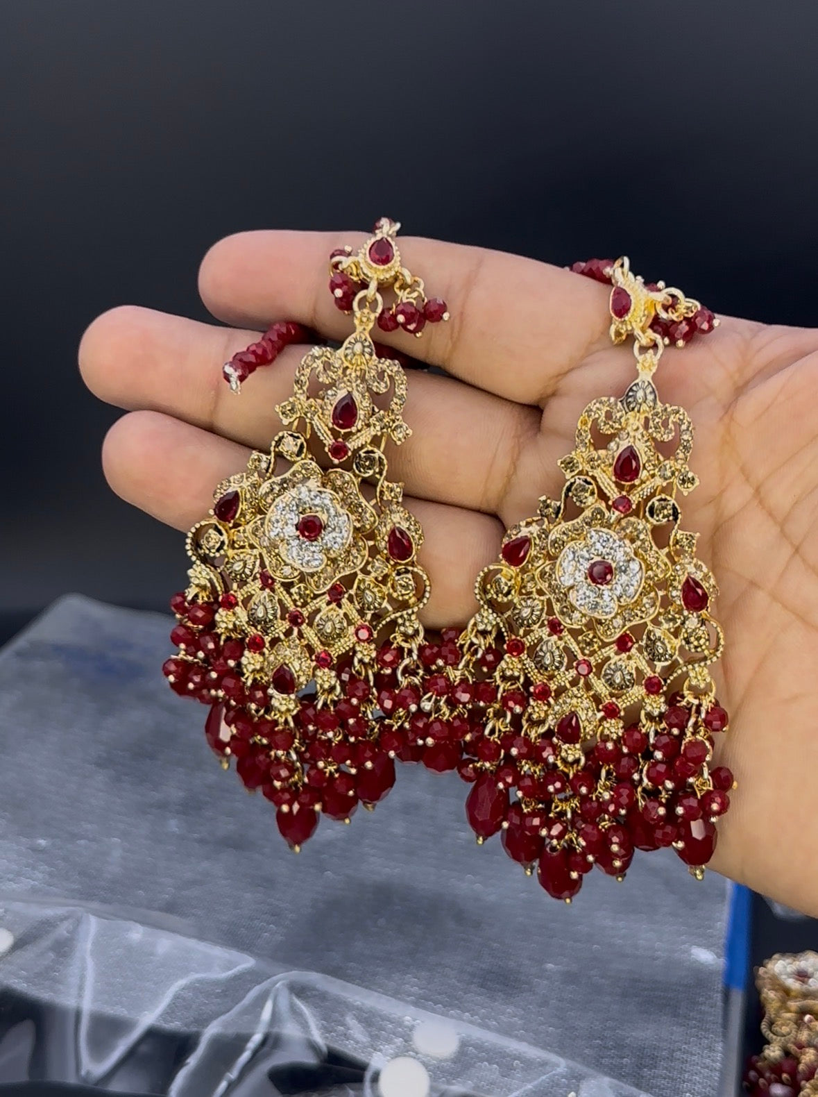 Pakistani bridal earrings with mehroon beads, rhinestones and zarkoon stones