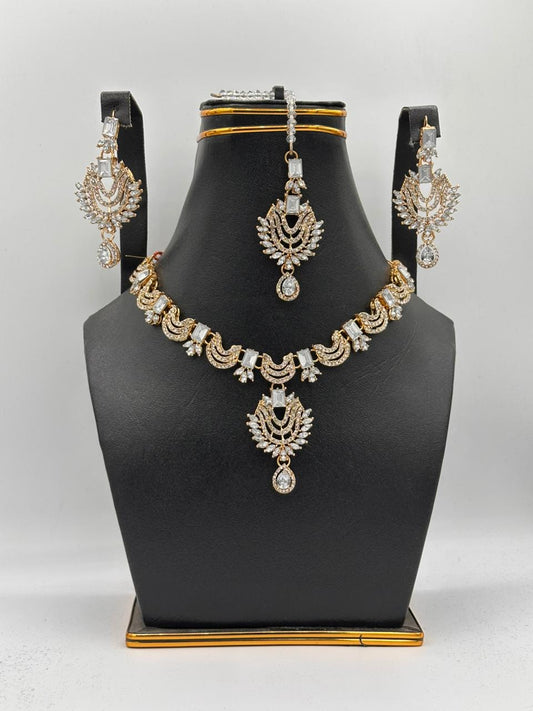 Timeless Kundan-Style Gold Choker Set with Floral Maang Tikka